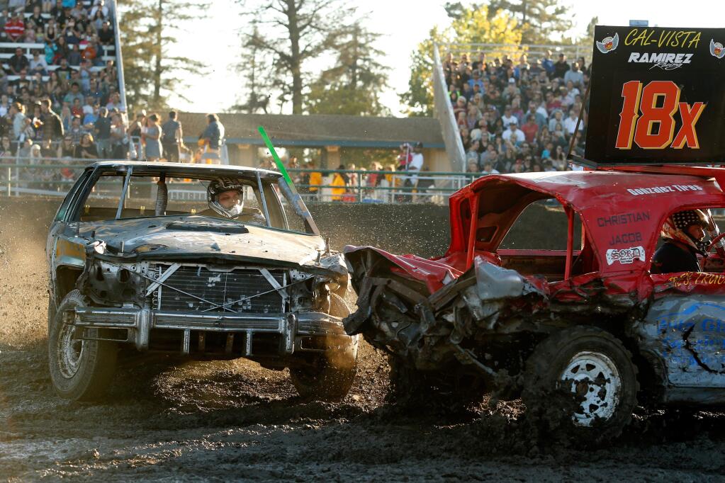 Rookie driver Liam Martin, left, of Forestville smashes into the rear of Hector Ramirez's car during the Destruction Derby at the Sonoma County Fair in Santa Rosa, California on Saturday, July 30, 2016. (Alvin Jornada / The Press Democrat)