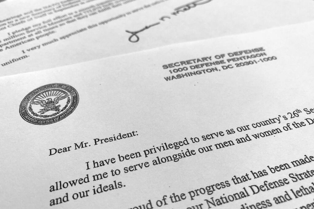 Part of Defense Secretary Jim Mattis' resignation letter to President Donald Trump is photographed in Washington, Thursday, Dec. 20, 2018. Mattis is stepping down from his post, Trump announced, after the retired Marine general clashed with the president over a troop drawdown in Syria and Trump's go-it-alone stance in world affairs. (AP Photo/Jon Elswick)