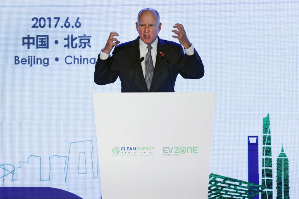 California Gov. Jerry Brown speaks during the Clean Energy Ministerial International Forum on Electric Vehicle Pilot Cities and Industrial Development at a hotel in Beijing, Tuesday, June 6, 2017. Brown predicts that President Donald Trump's decision to pull the U.S. out of the Paris climate accord will prove temporary because of the urgency of the issue. He told The Associated Press on the sidelines of a clean energy conference in Beijing on Tuesday that China, Europe and U.S. state governors will for now fill the gap left by the federal government's move to abdicate leadership on the issue. (AP Photo/Andy Wong)
