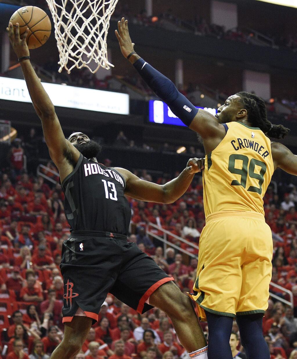 Houston Rockets guard James Harden drives to the basket as Utah Jazz forward Jae Crowder defends during the first half in Game 1 of a second-round playoff series, Sunday, April 29, 2018, in Houston. (AP Photo/Eric Christian Smith)