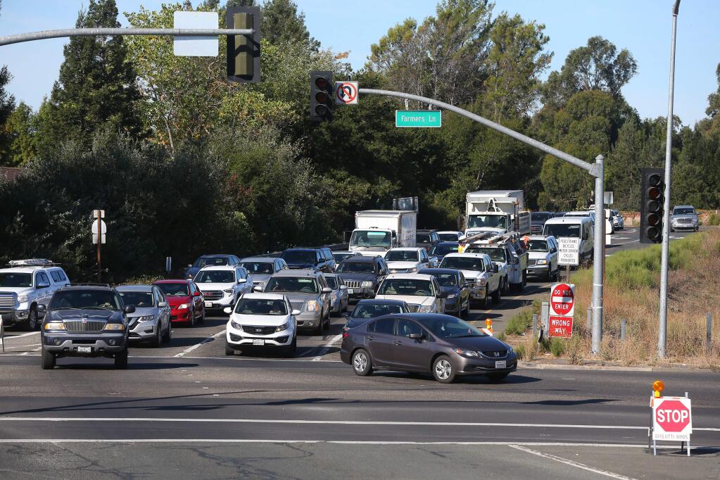 Traffic backs up along Highway 12 at Farmers Lane with the traffic signals being off due to the PG&E power shutdown in Santa Rosa on Thursday, October 10, 2019. (Christopher Chung/ The Press Democrat)