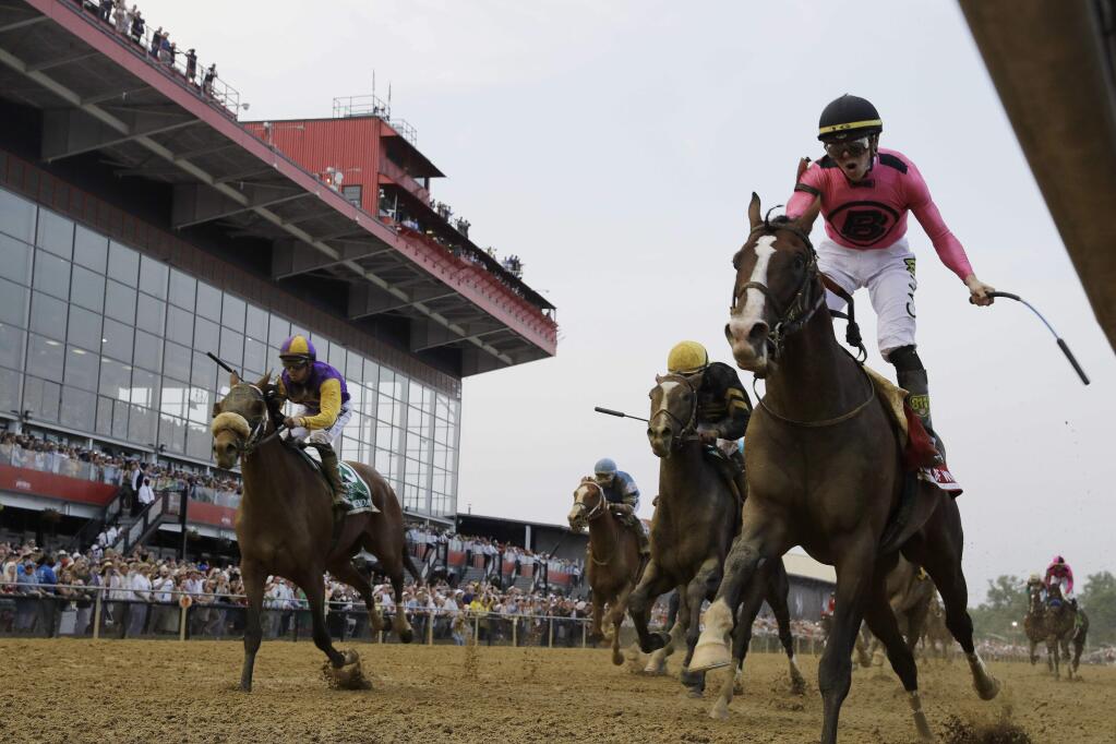War of Will, ridden by Tyler Gaffalione, right, crosses the finish line first to win the Preakness Stakes horse race at Pimlico Race Course, Saturday, May 18, 2019, in Baltimore.(AP Photo/Steve Helber)