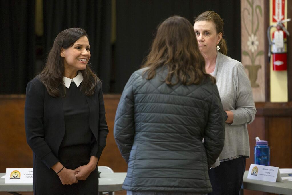 Karlene Navarro, left, the new director of the Sonoma County Independent Office of Law Enforcement Review and Outreach (IOLERO), talks with members of the Community Advisory Council before a meeting in Windsor on Monday. (photo by John Burgess/The Press Democrat)