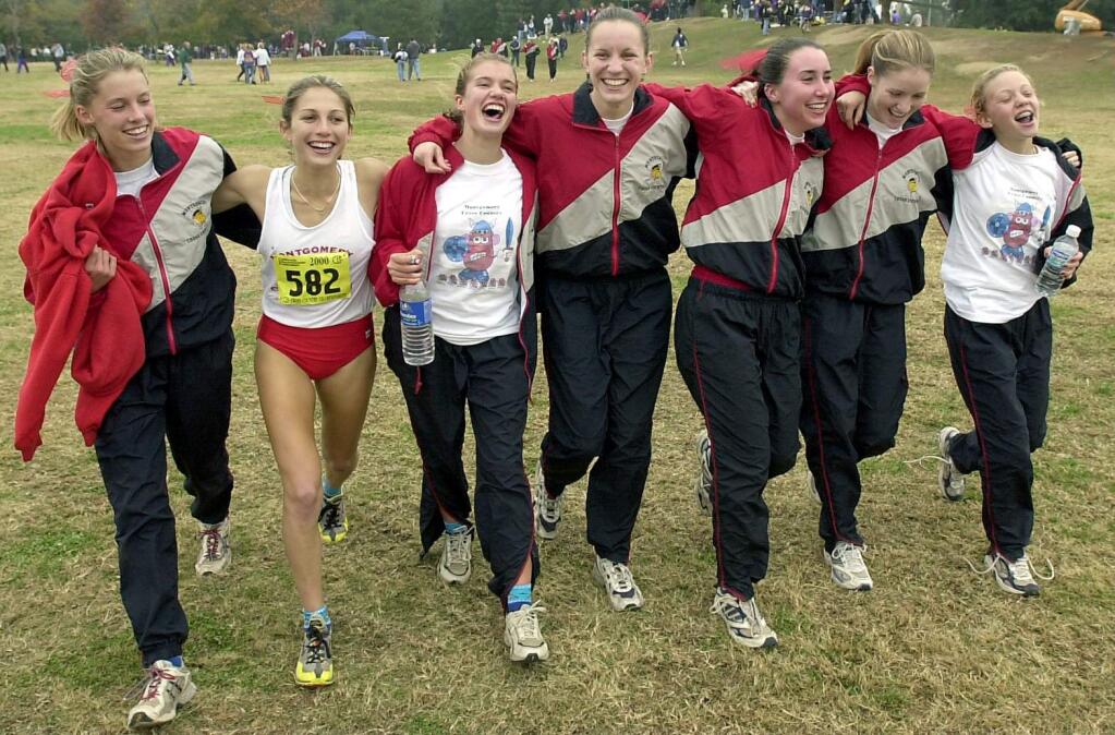 Kim Conley, third from left, and the Montgomery girls cross country team captured a state title in 2000, the first Empire team to do so.