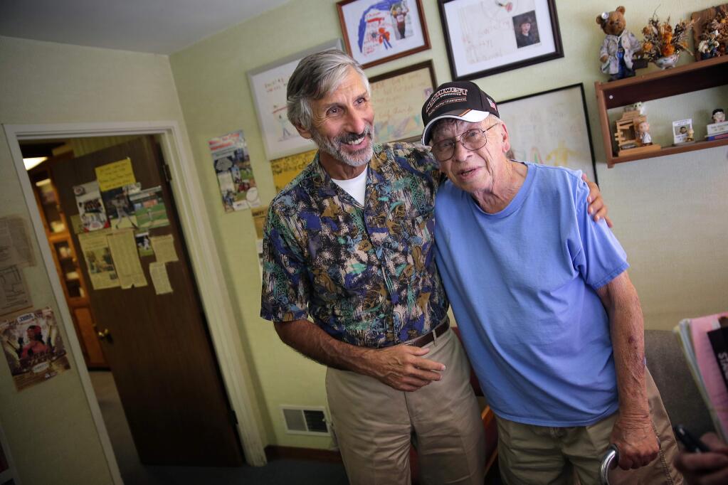 Dr. David Charp, left, gives his patient Bill Mumm a hug after giving him all his his medical records in Santa Rosa on Friday, July 18, 2014. Dr. Charp is retiring from medicine on his 70th birthday on August 6th. (Conner Jay/The Press Democrat)