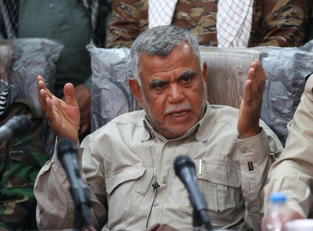 Iraqi militia leader Hadi al-Amiri speaks to the press in Samarra, Iraq 95 kilometers (60 miles) north of Baghdad, Iraq, Wednesday, March 25, 2015. (AP Photo/Karim Kadim)