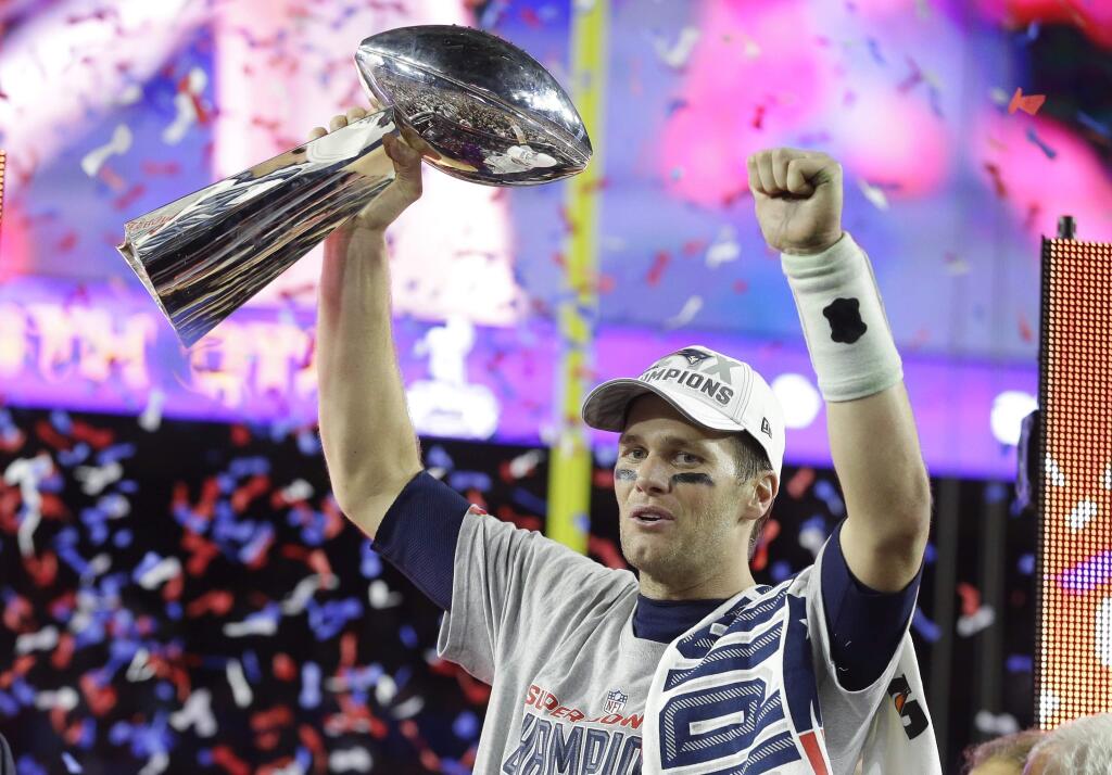FILE - In this Feb. 1, 2015, file photo, New England Patriots quarterback Tom Brady celebrates with the Vince Lombardi Trophy after the NFL Super Bowl XLIX football game against the Seattle Seahawks in Glendale, Ariz. Tom Brady is the poster boy for draft steals. (AP Photo/Michael Conroy, File)