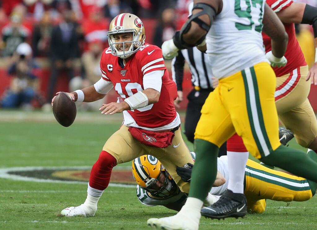 San Francisco 49ers quarterback Jimmy Garoppolo is sacked by the Green Bay Packers defense, during their NFC Championship game at Levi's Stadium in Santa Clara on Sunday, January 19, 2020. The 49ers defeated the Packers 37-20.(Christopher Chung/ The Press Democrat)