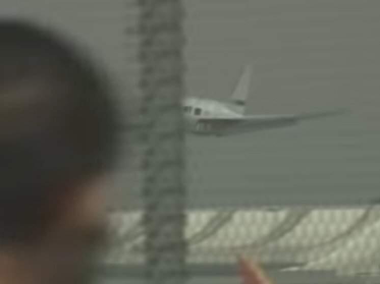 In a screenshot from video, a plane is shown making an emergency landing on its belly at Norman Y. Mineta San Jose International Airport in San Jose on Friday, Feb. 28, 2020. (AP/ YOUTUBE)