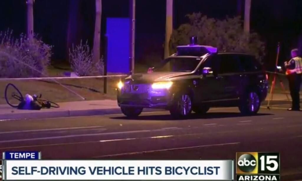 A still image taken from video shows investigators at the scene of a fatal accident Monday in Tempe, Arizona involving a cyclist and a self-driving car.(Associated Press)