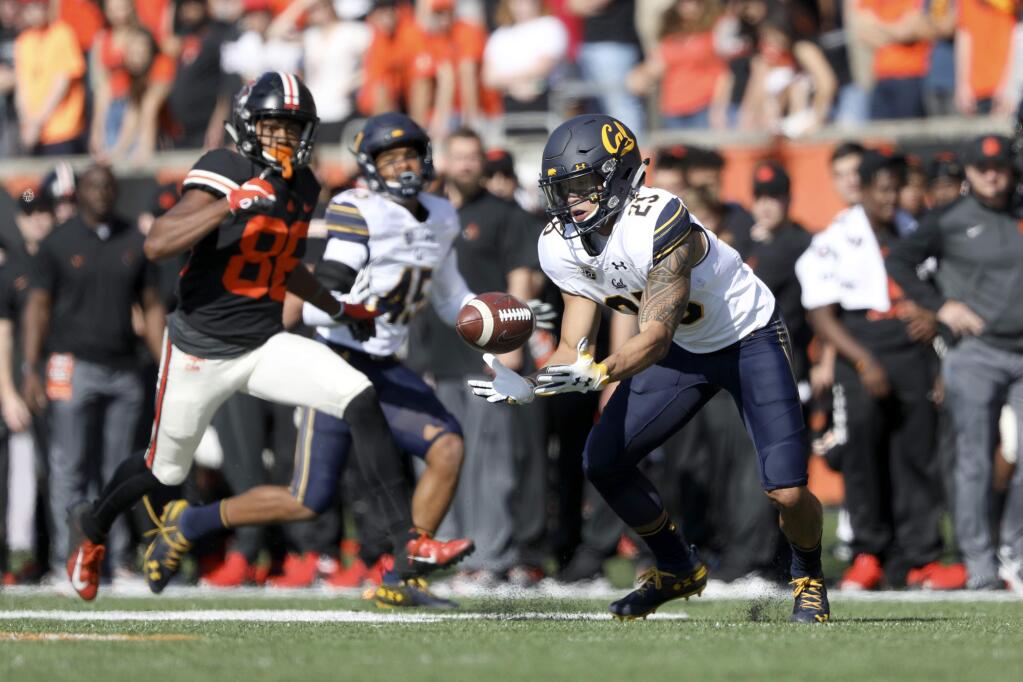 Cal wide receiver Nikko Remigio fields a pass during the first half against Oregon State in Corvallis, Ore., Saturday, Oct. 20, 2018. (AP Photo/Amanda Loman)