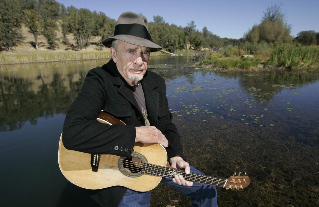 FILE - In this Oct. 2, 2007 file photo, Merle Haggard poses at his ranch at Palo Cedro, Calif. Haggard died of pneumonia, Wednesday, April 6, 2016, in Palo Cedro, Calif. He was 79. (AP Photo/Rich Pedroncelli, FIle)