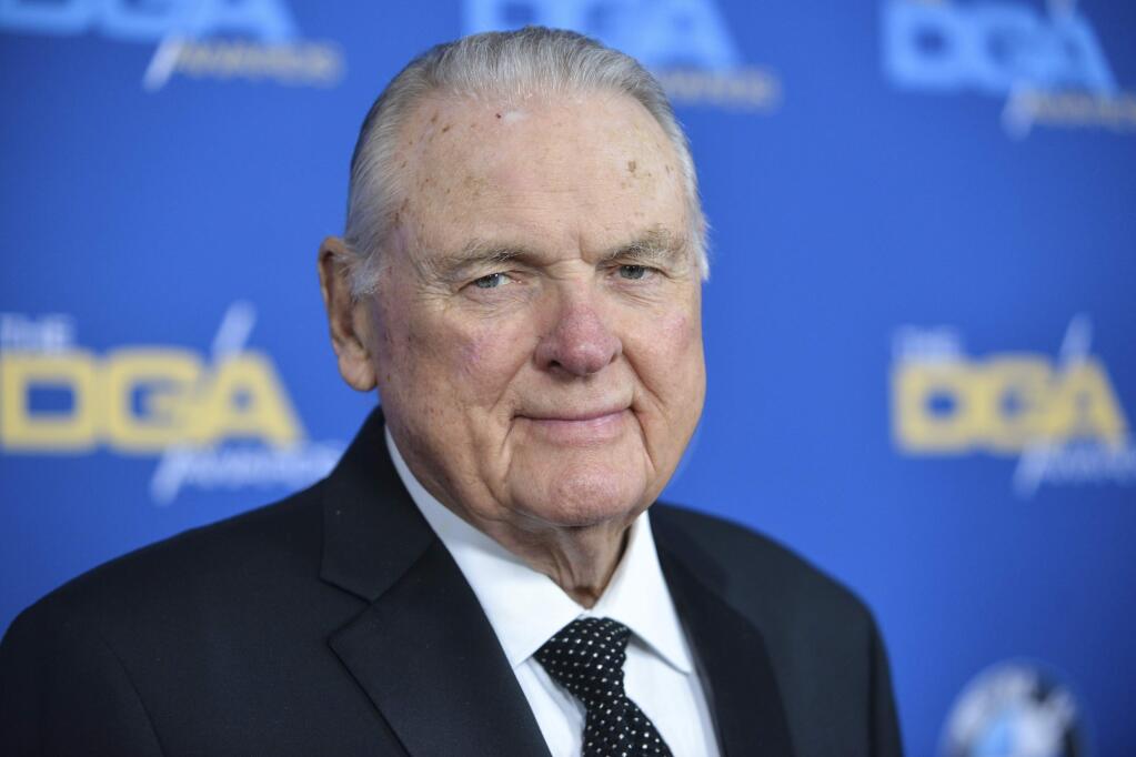 FILE - In this Jan. 25, 2014, file photo, Keith Jackson arrives at 66th Annual DGA Awards Dinner at the Hyatt Regency Century Plaza Hotel in Los Angeles. Jackson, the down-home voice of college football during more than five decades as a broadcaster, died Friday, Jan. 12, 2018. He was 89. (Photo by Richard Shotwell Invision/AP, File)