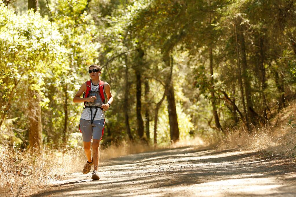 A trail runner who declined to give his name jogs down a path at Annadel State Park on Wednesday, July 20, 2016. (Alvin Jornada / The Press Democrat)