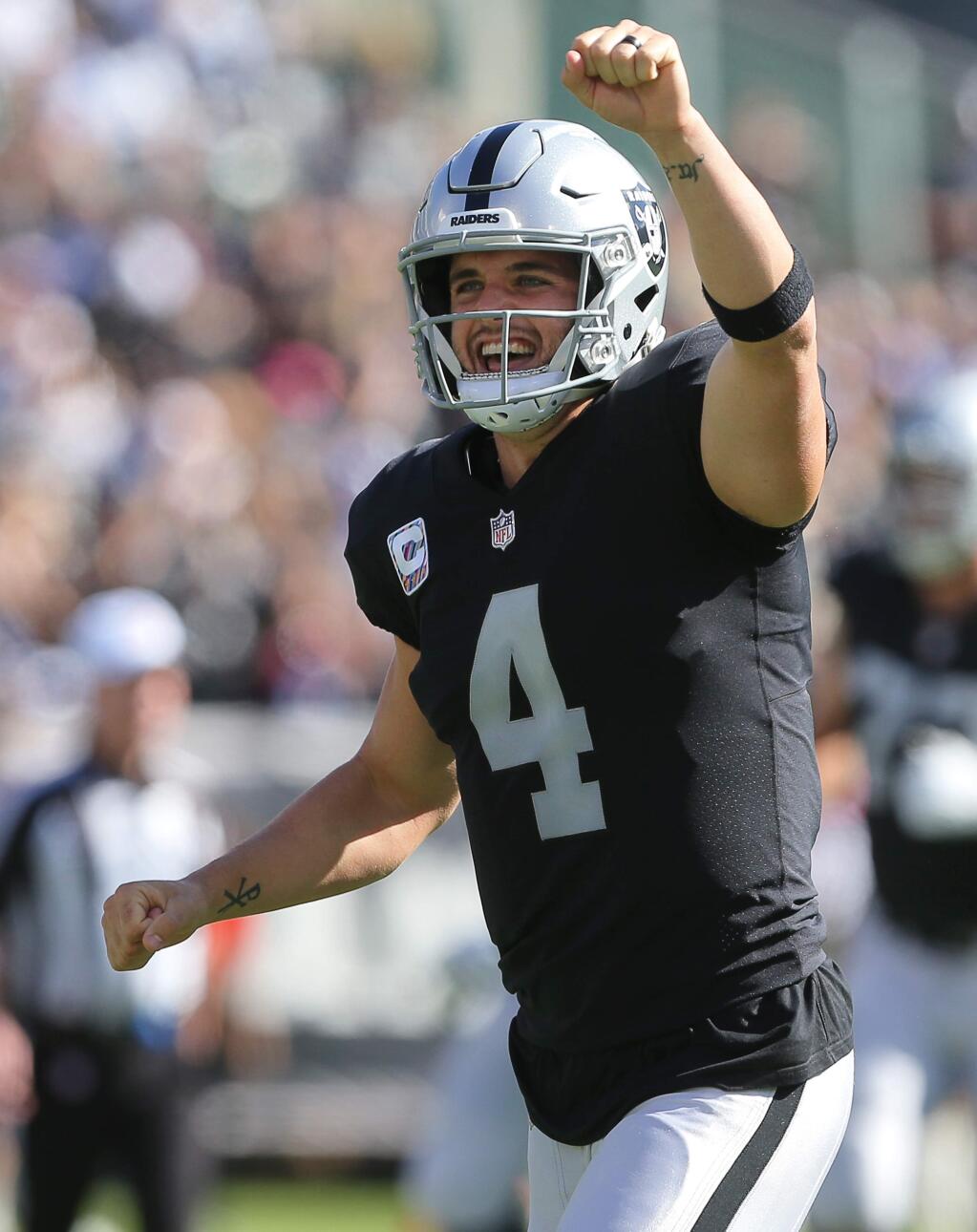 Oakland Raiders quarterback Derek Carr celebrates a touchdown against the Indianapolis Colts, during their game in Oakland on Sunday, October 28, 2018. The Colts defeated the Raiders 42-28. (Christopher Chung/ The Press Democrat)