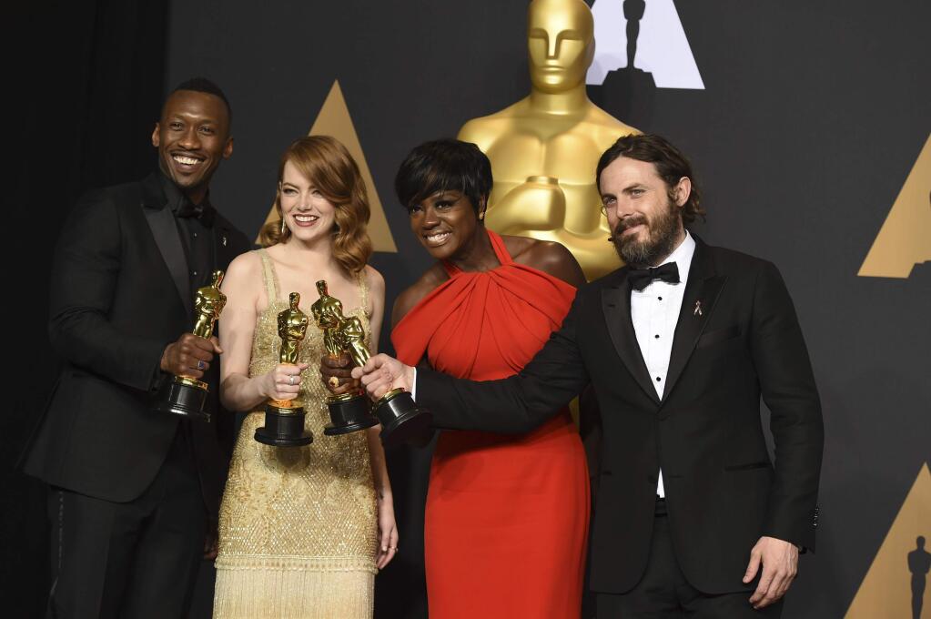 Mahershala Ali, winner of the award for best actor in a supporting role for 'Moonlight', from left, Emma Stone, winner of the award for best actress in a leading role for 'La La Land', Viola Davis, winner of the award for best actress in a supporting role for 'Fences', and Casey Affleck, winner of the award for best actor in a leading role for 'Manchester by the Sea', pose in the press room at the Oscars on Sunday, Feb. 26, 2017, at the Dolby Theatre in Los Angeles. (Photo by Jordan Strauss/Invision/AP)