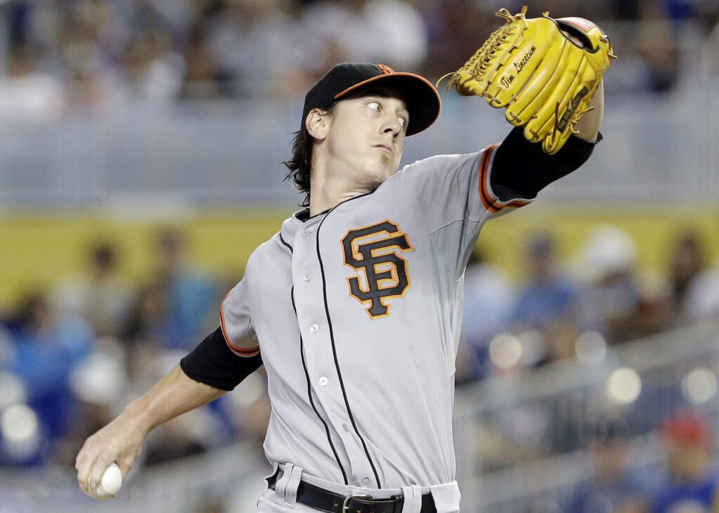 San Francisco Giants' Tim Lincecum delivers a pitch during the first inning of a baseball game against the Miami Marlins, Sunday, July 20, 2014 in Miami. (AP Photo/Wilfredo Lee)