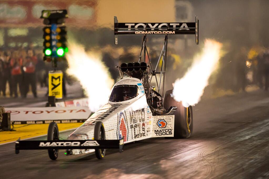Antron Browns top fuel dragster blazes down the track. Photo by Robert Redmond