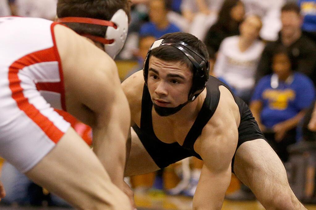Upper Lake's Jose Fernandez III, right, shown during the King of the Mat wrestling tournament at Windsor High School in January 2018. (Alvin Jornada / The Press Democrat)