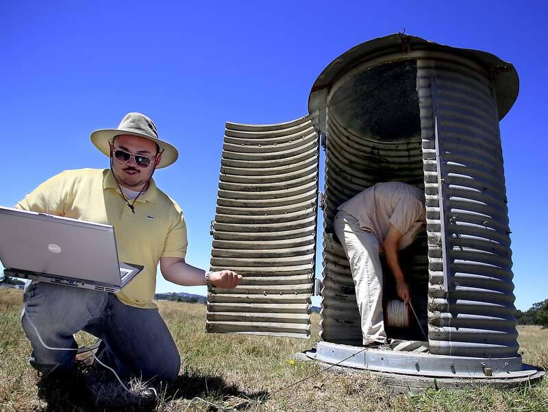 Sonoma County Water Agency employees George Howard, left and John Mendoza monitor a water well off Todd Road in Santa rosa, Wednesday July 10, 2013. The well tops are in the silo. (Kent Porter / Press Democrat) 2013