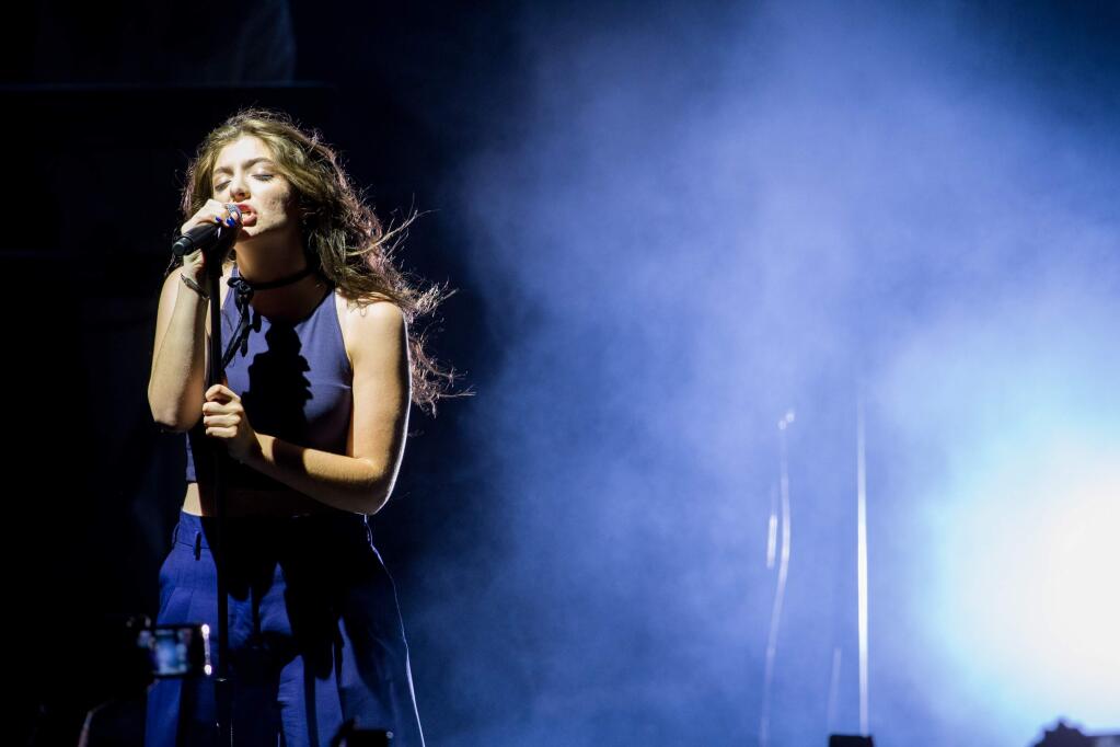 Lorde performs on stage at the Greek Theatre on Monday, Oct. 6, 2014, in Los Angeles. (Photo by Paul A. Hebert/Invision/AP)
