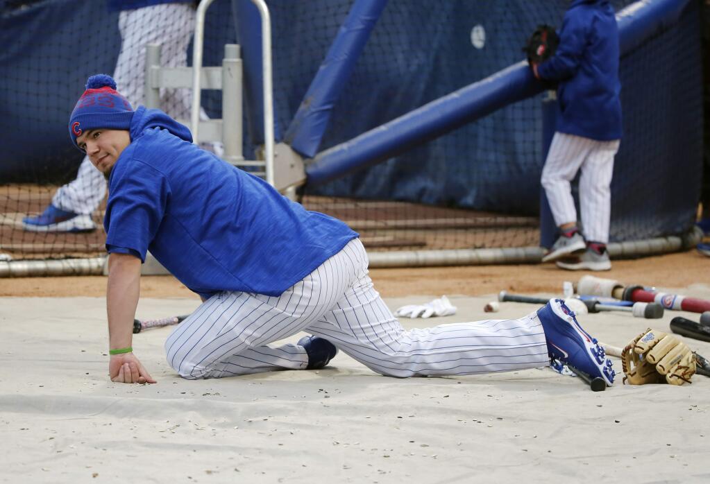 Chicago Cubs' Kyle Schwarber stretches as he works out for Friday's Game 3 of the Major League Baseball World Series against the Cleveland Indians, Thursday, Oct. 27, 2016, in Chicago. (AP Photo/Charles Rex Arbogast)