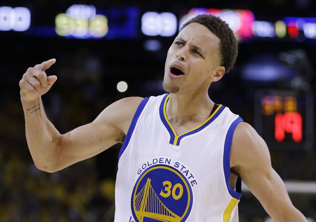 Golden State Warriors guard Stephen Curry (30) celebrates during the second half of Game 5 of basketball's NBA Finals against the Cleveland Cavaliers in Oakland, Calif., Sunday, June 14, 2015. The Warriors won 104-91. (AP Photo/Ben Margot)