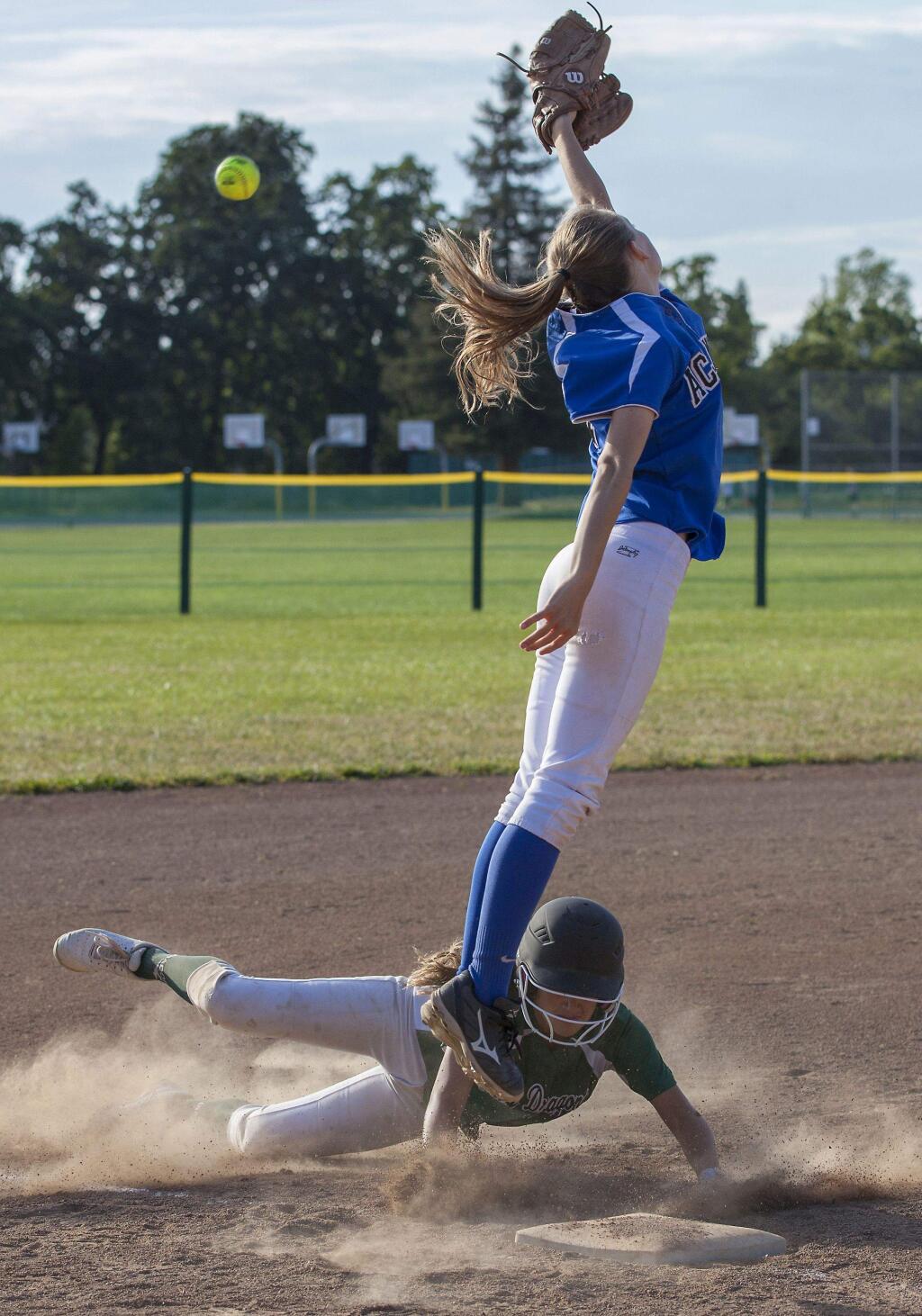 A Sonoma Valley player slides into third beneath a wild throw during Tuesday, May 24 action at Arnold Field. The Lady Dragons softball team lost the playoff game against Acalanes by a score of 13-8. (Photos by Robbi Pengelly/Index-Tribune)