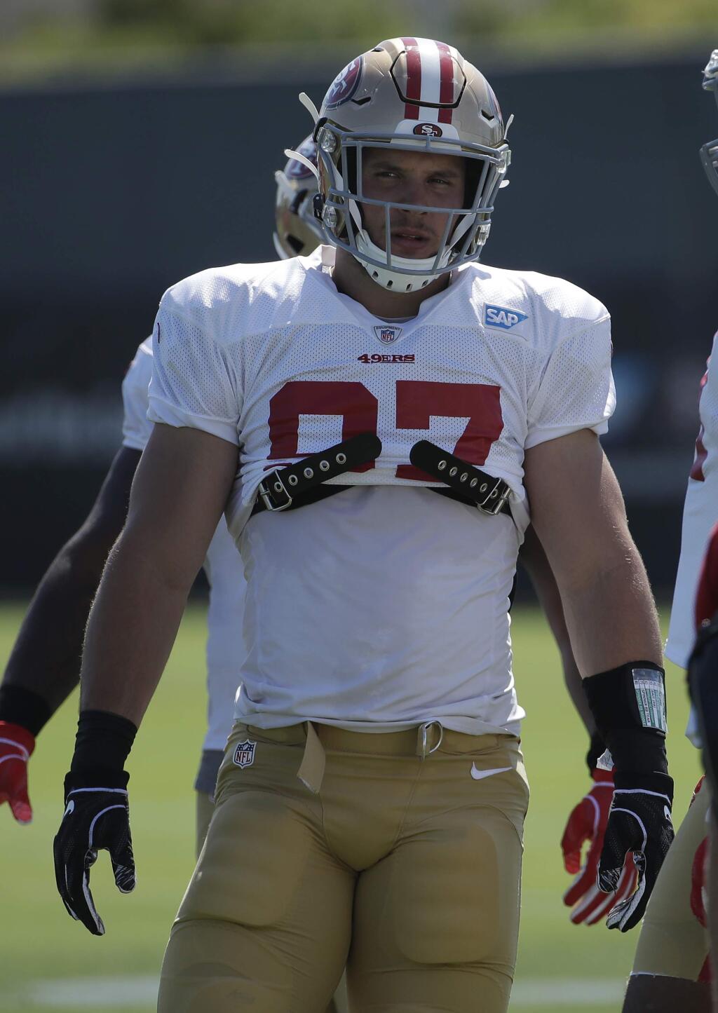 San Francisco 49ers' Nick Bosa stands on the field at the team's NFL football training camp in Santa Clara, Calif., Monday, July 29, 2019. (AP Photo/Jeff Chiu)