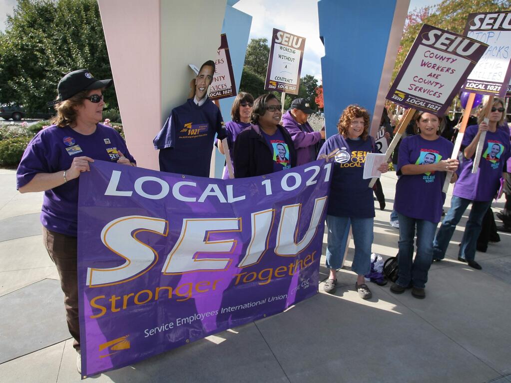 SEIU LOCAL 1021 representatives and members gather in 2008 to enter the Board of Supervisors chambers for a public hearing protesting negotiations. (PD File)