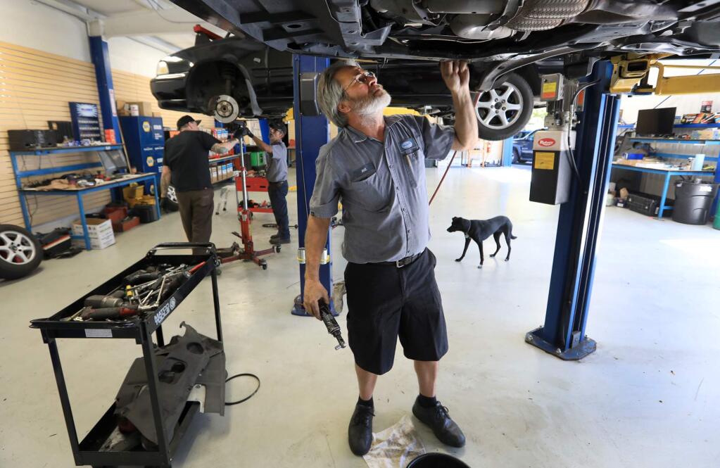 Lead SAL auto mechanic Bill Paterson diagnoses a problem with a car, August 31, 2017 in Santa Rosa. (Kent Porter / The Press Democrat) 2017