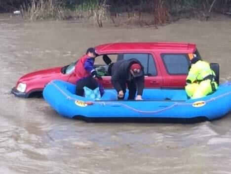 A person was rescued from a car on flooded Corona Road in Petaluma on Sunday, Jan. 8, 2017. (COURTESY OF PETALUMA POLICE LT. TIM LYONS)