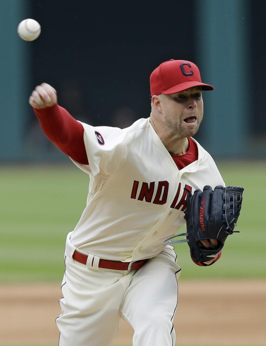 Cleveland Indians starting pitcher Corey Kluber delivers in the first inning of a baseball game against the Oakland Athletics, Sunday, July 12, 2015, in Cleveland. (AP Photo/Tony Dejak)