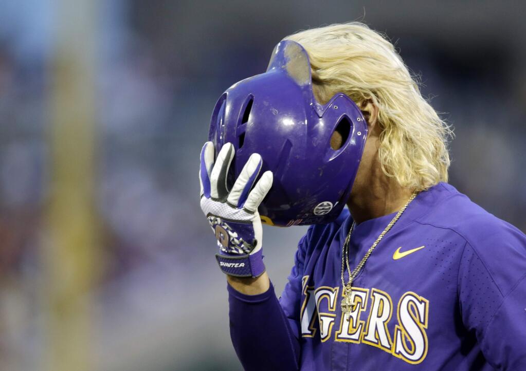 LSU's Kramer Robertson reacts after being thrown out at first base to end the top of the fifth inning against Florida in Game 2 of the NCAA College World Series baseball finals in Omaha, Neb., Tuesday, June 27, 2017. (AP Photo/Nati Harnik)