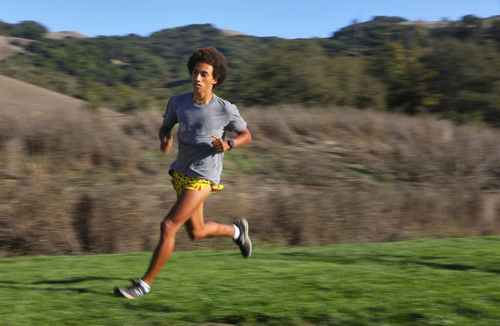 Sonoma Academy cross country runner Andre Williams runs a set of 200-meter intervals in Santa Rosa on Tuesday, October 23, 2018. (Christopher Chung / The Press Democrat)