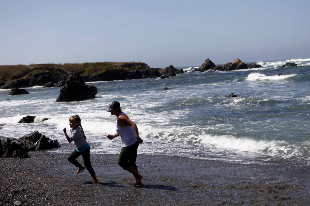 Sarah Neisingh and her daughter, Tori, 6, run on the beach at MacKerricher State Park on Thursday, September 1, 2011, three miles north of Ft. Bragg near the town of Cleone, California. (BETH SCHLANKER/ The Press Democrat)