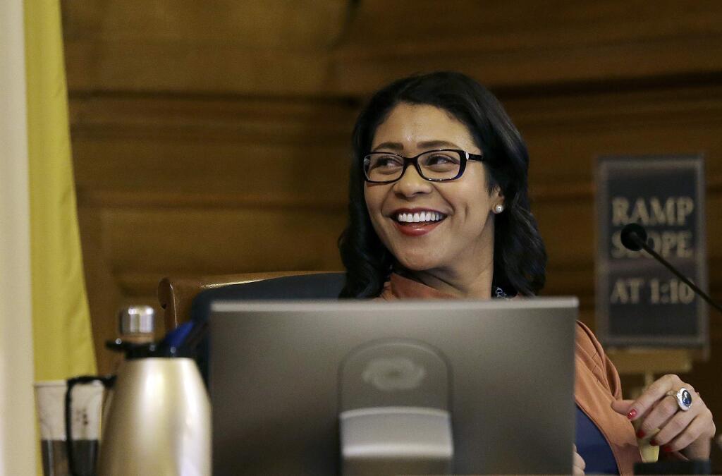 FILE - In this Dec. 12, 2017 file photo, San Francisco Board of Supervisors President and acting mayor London Breed smiles at a Board of Supervisors meeting at City Hall in San Francisco. Candidates face a deadline Tuesday, Jan. 9, 2018, to enter the 2018 race for mayor, a contest moved up by more than a year after the sudden death of Mayor Ed Lee last month. (AP Photo/Jeff Chiu, File)
