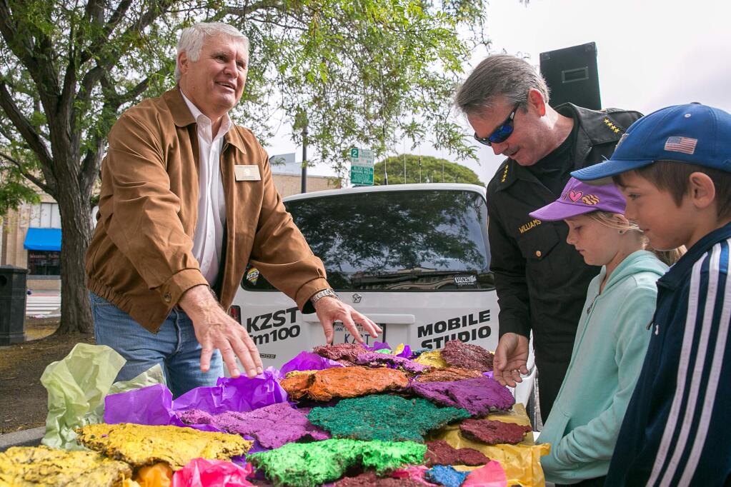 Chris Albertson, City Councilmember, and Patrick Williams examine the cow chips before the Cow Chip Throwing Contest at Butter and Egg Days in Petaluma on Saturday, April 25, 2015. (RACHEL SIMPSON/FOR THE ARGUS-COURIER)