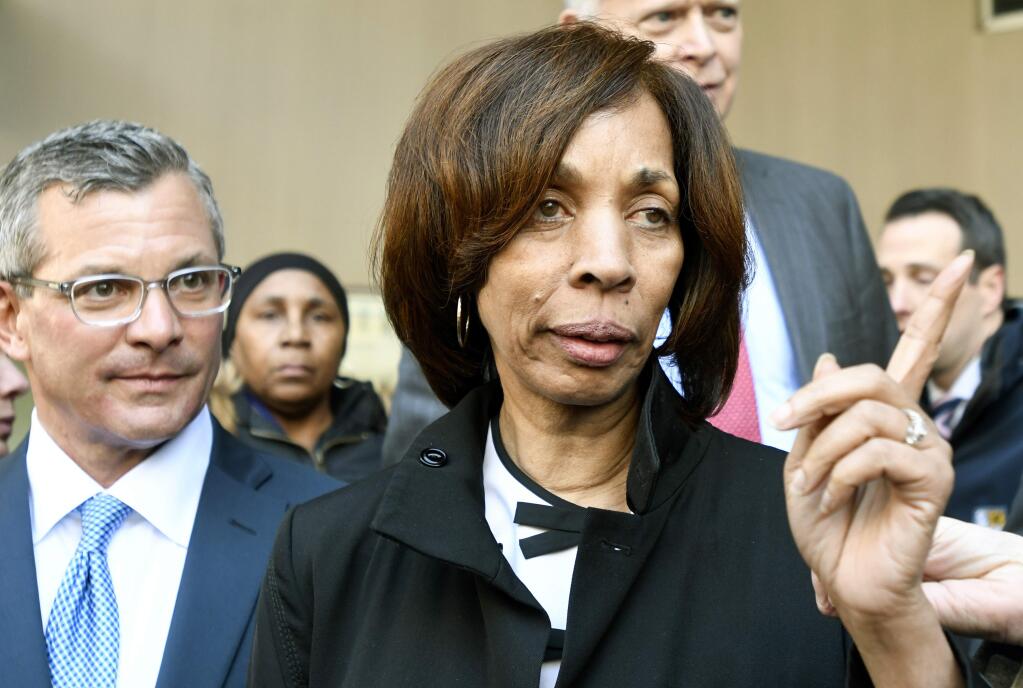 Former Baltimore Mayor Catherine Pugh and her attorney Steven Silverman, left, leave a sentencing hearing at U.S. District Court in Baltimore on Thursday, Feb. 27, 2020. Pugh was sentenced to three years in federal prison for arranging fraudulent sales of her self-published children's books to nonprofits and foundations to promote her political career. (AP Photo/Steve Ruark)