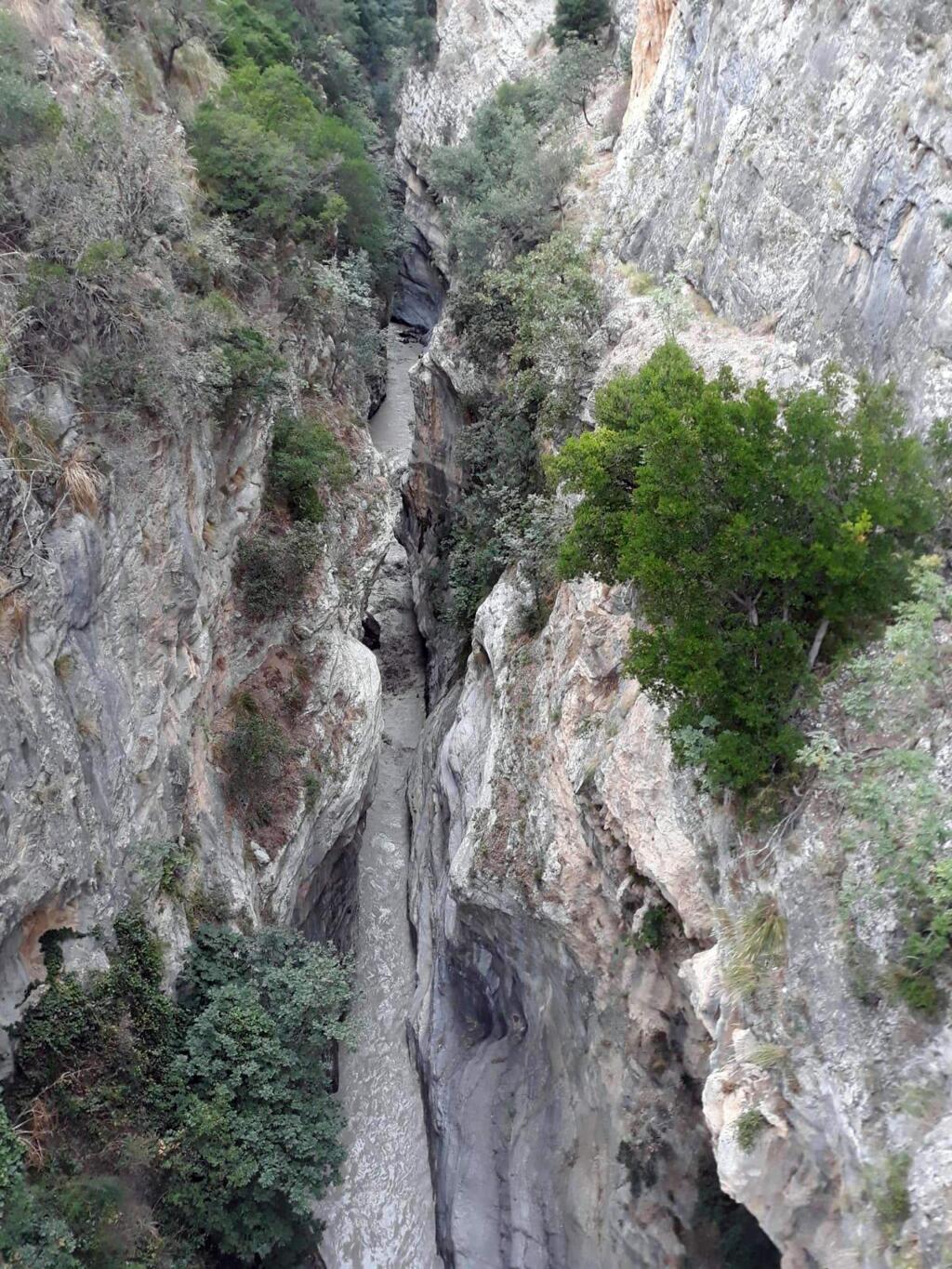 A view of the Raganello Gorge in Civita, Italy, Monday, Aug. 20, 2018. Italy's civil protection agency says at least five people have been killed when a rain-swollen river flooded a gorge in the southern region of Calabria. The Italian news agency ANSA reported Monday that 12 people were brought to safety in the flash flood. It was unclear how many people were missing. The flood hit a group of hikers in the Raganello Gorge. (Antonio Iannicelli/ANSA via AP)