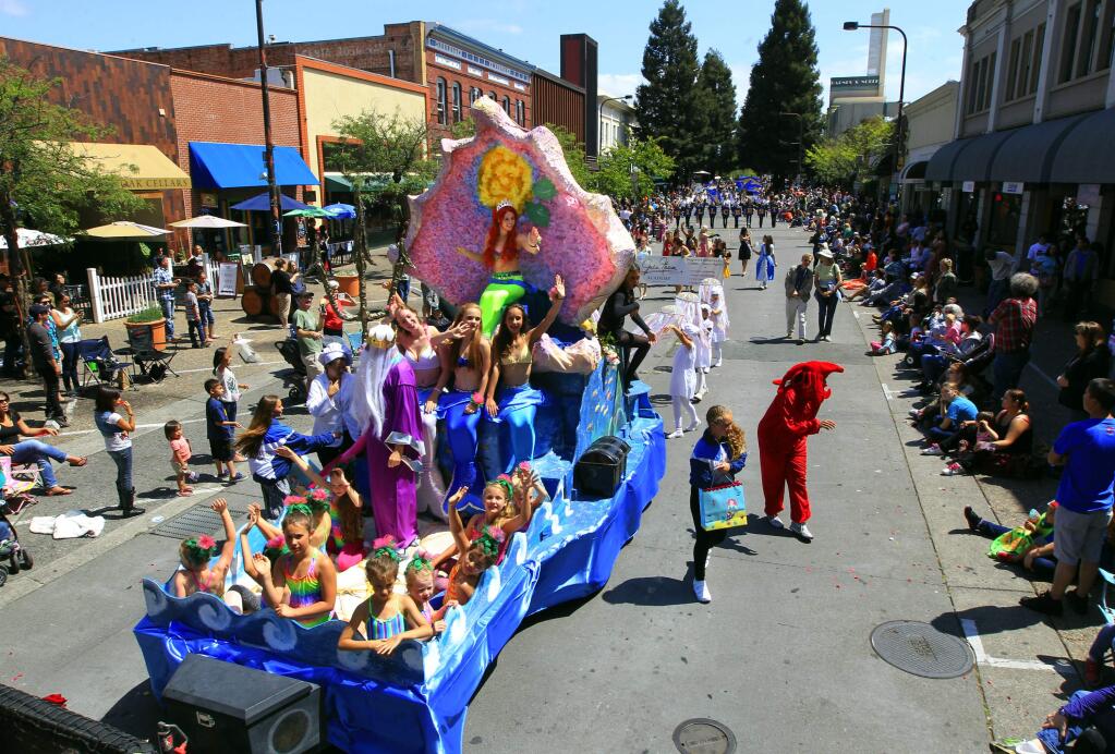 The Oak Park Aqua Stars float heads down 4th St. during the 121st annual Santa Rosa Rose Parade on Saturday. (JOHN BURGESS / The Press Democrat)
