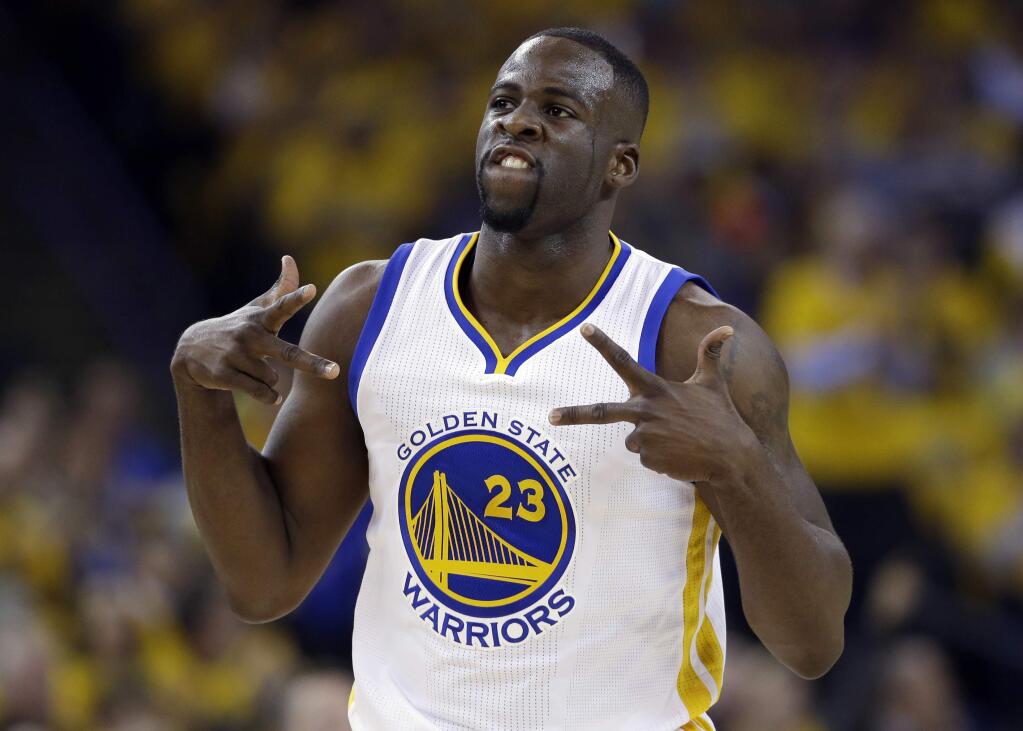 FILE - In this April 27, 2016, file photo, Golden State Warriors' Draymond Green celebrates after scoring against the Houston Rockets during the first half in Game 5 of a first-round NBA basketball playoff series, in Oakland, Calif. Green was arrested for an alleged assault over the weekend in East Lansing, Michigan, according to online court records.The incident occurred around 2:30 a.m. Sunday, July 10, 2016, in the city where Green played for Michigan State from 2008-12. (AP Photo/Marcio Jose Sanchez, File)