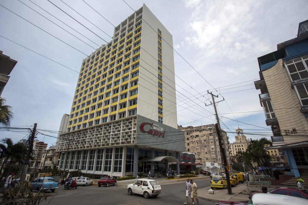 The Hotel Capri in Havana, Cuba, is photographed Tuesday, Sept. 12, 2017. New details about a string of mysterious “health attacks” on U.S. diplomats in Cuba indicate the incidents were narrowly confined within specific rooms or parts of rooms. Aside from their homes, officials said Americans were attacked in at least one hotel, the recently renovated Hotel Capri, steps from the Malecon, Havana's iconic, waterside promenade.(AP Photo/Desmond Boylan)