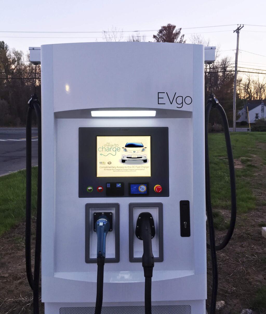 This Monday, April 17, 2017 photo shows a charging station for electric cars in Guilderland, N.Y For drivers of electric cars in remote areas, 'range anxiety' can be more pronounced when the nearest charging station is dozens of miles away over winding roads. Cold winters take a bite out of battery power, as do steep hills. (AP Photo/Michael Hill)