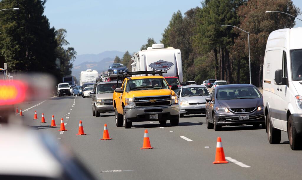 Traffic backs up for miles in both directions after a traffic accident on southbound Highway 101 in Santa Rosa, Friday, June 19, 2015. In a report by Allstate, Santa Rosa ranked 105th for driver safety among the 200 largest cities in the United States. (CRISTA JEREMIASON / The Press Democrat)