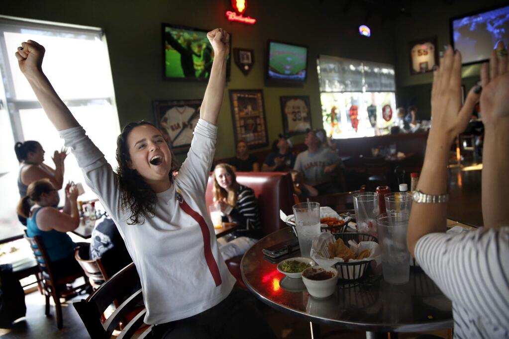 Soccer fan Kayla Kearney reacts at Beyond The Glory Sports Bar and Grill as the USA beats Japan during the World Cup final on Sunday, July 5, 2015 in Petaluma. (BETH SCHLANKER/ The Press Democrat)