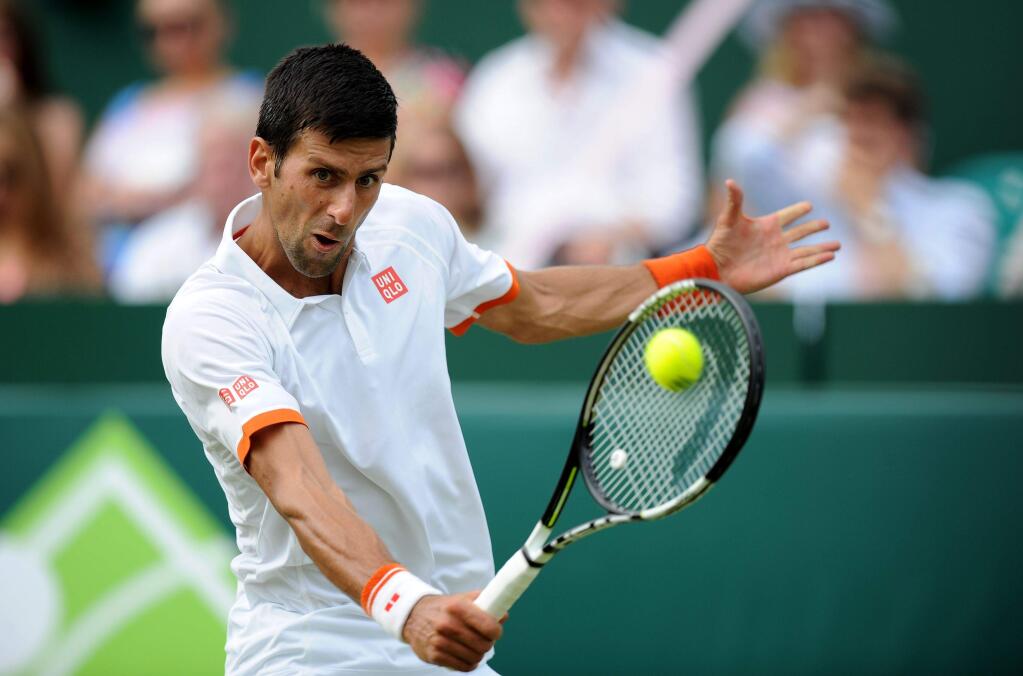 Serbia's Novak Djokovic in action against France's Richard Gasquet during day three of The Boodles tennis tournament at Stoke Park, near Stoke Poges, England, Thursday June 25, 2015. (Andrew Matthews/PA via AP) UNITED KINGDOM OUT NO SALES NO ARCHIVE