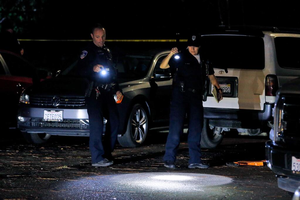 Santa Rosa Police officers investigate the scene of a shooting that occurred on Grand Avenue in Santa Rosa, California, on Monday, Dec. 2, 2019. (ALVIN JORNADA/ PD)