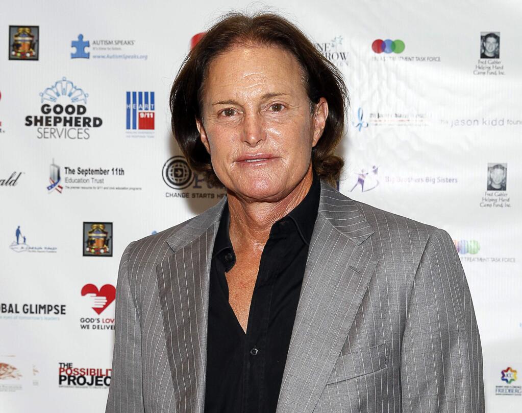 FILE - In this Sept. 11, 2013, file photo, former Olympic athlete Bruce Jenner arrives at the Annual Charity Day hosted by Cantor Fitzgerald and BGC Partners, in New York. ABC said it will air a two-part ìKeeping Up With the Kardashiansî on Sunday, May 10, 2015, and Monday, May 11, to broadcast intimate conversations and emotional moments Jenner shares with his family as they discuss his transition into life as a woman. (Photo by Mark Von Holden/Invision/AP, File)