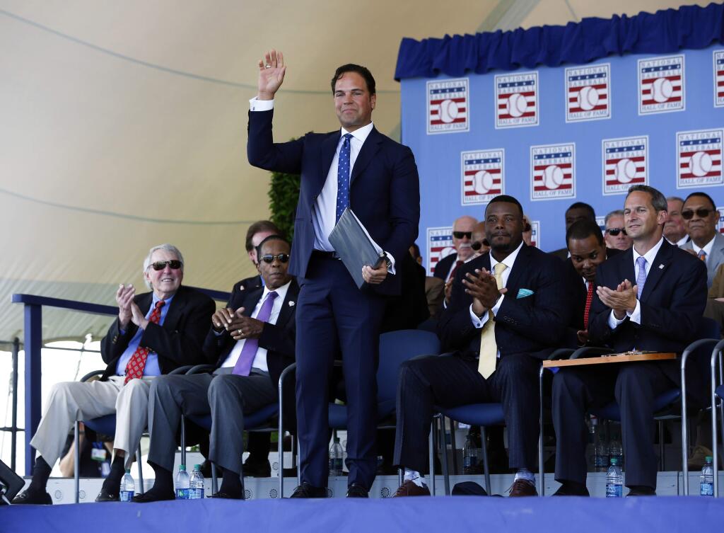 National Baseball Hall of Fame inductee Mike Piazza stands before speaking during the induction ceremony at Clark Sports Center on Sunday, July 24, 2016, in Cooperstown, N.Y. (AP Photo/Mike Groll)